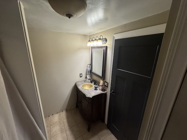 bathroom featuring tile patterned floors and vanity