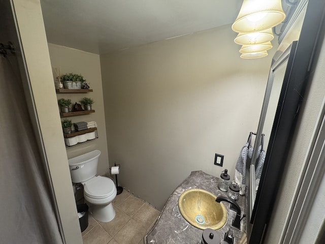 bathroom featuring vanity, toilet, and tile patterned floors