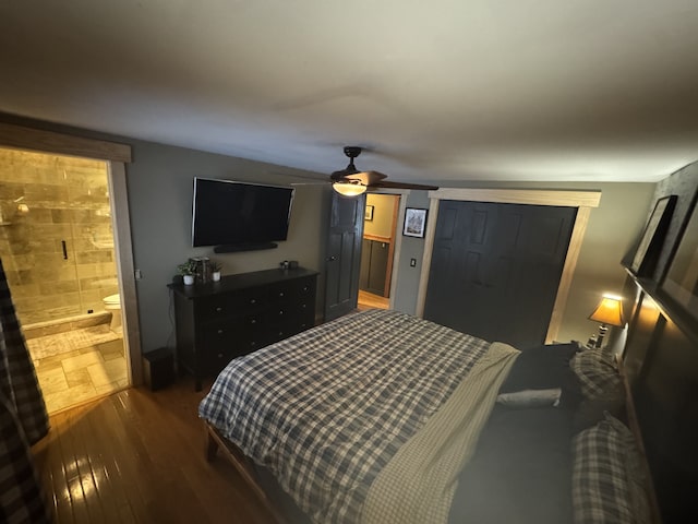 bedroom featuring ceiling fan, connected bathroom, and hardwood / wood-style flooring