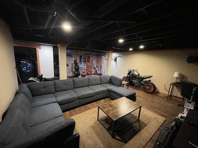 living room featuring hardwood / wood-style floors and washer / clothes dryer