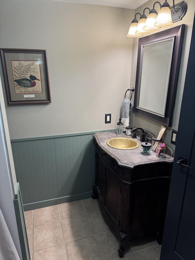 bathroom featuring wainscoting, vanity, and tile patterned floors