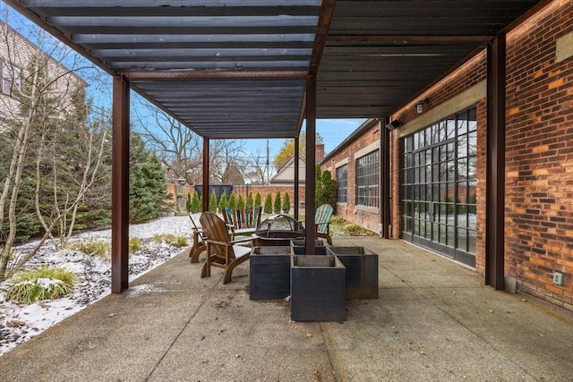 view of patio / terrace featuring a fire pit