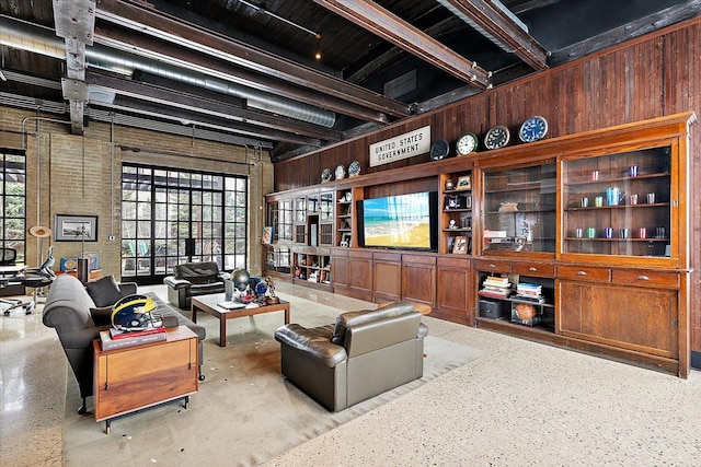 living room with wood walls