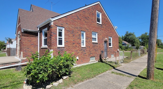 view of property exterior featuring a yard