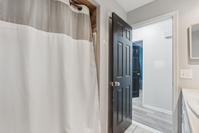 bathroom with a shower with curtain and vanity