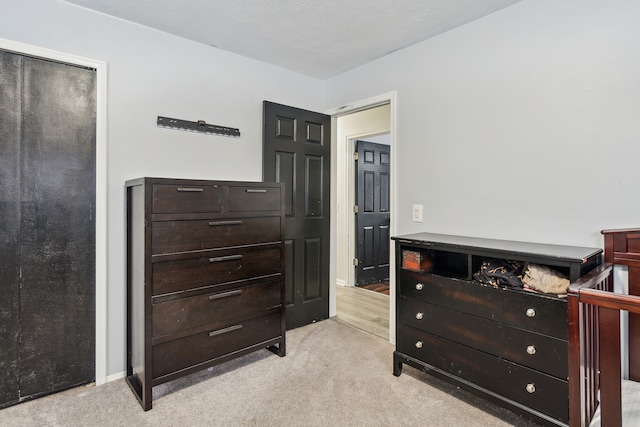 bedroom featuring light carpet