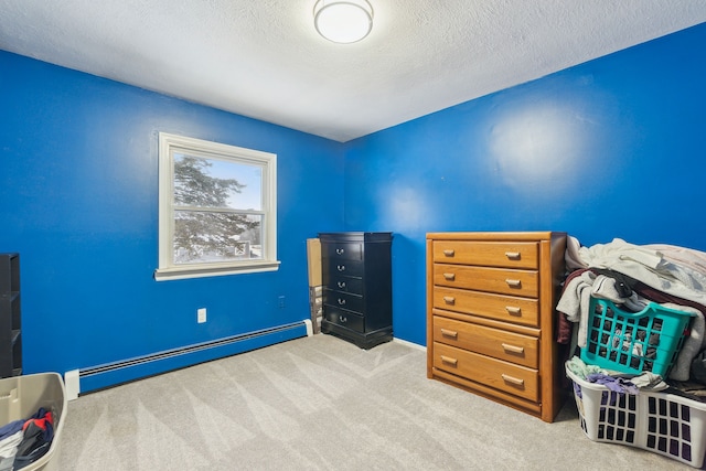 living area with light colored carpet, a textured ceiling, and baseboard heating