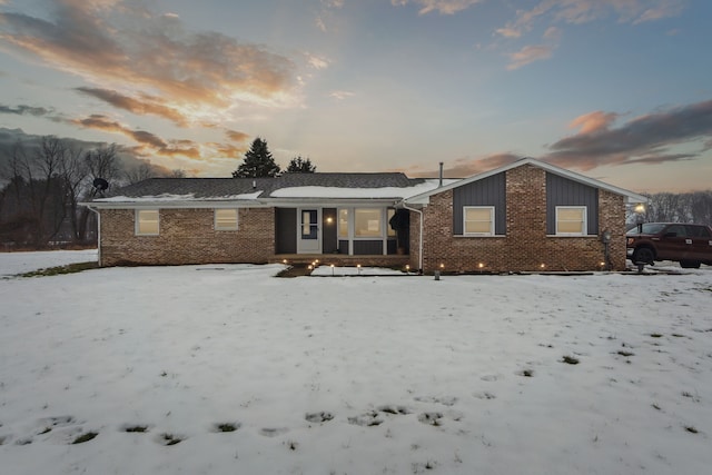 view of snow covered house