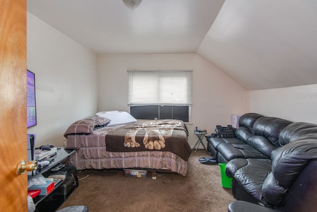 bedroom with carpet flooring and lofted ceiling