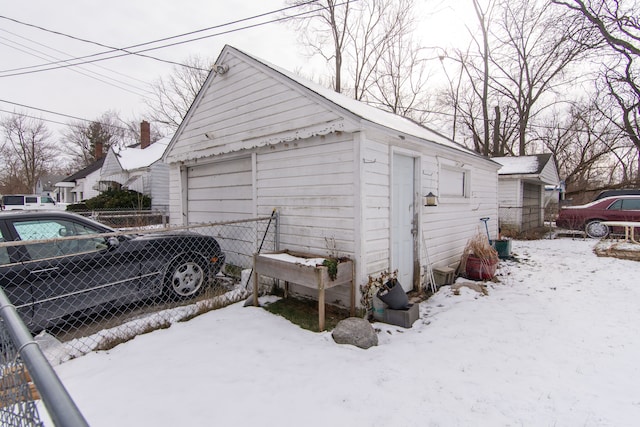 view of snow covered garage