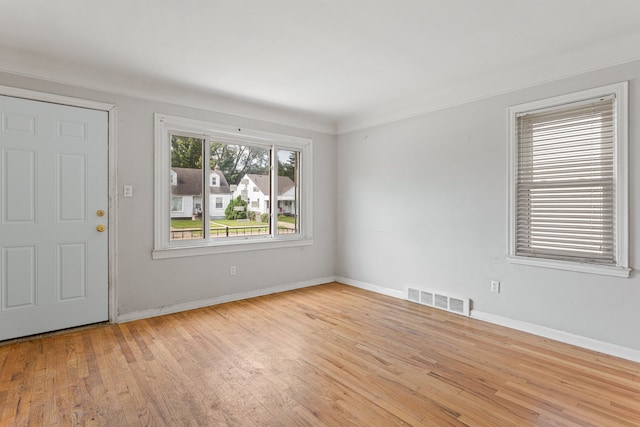 empty room with light hardwood / wood-style floors