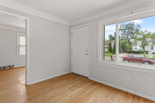 empty room with light hardwood / wood-style floors