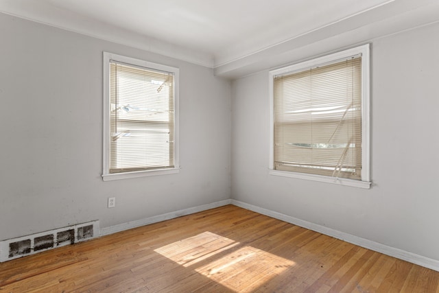 spare room featuring light wood-type flooring