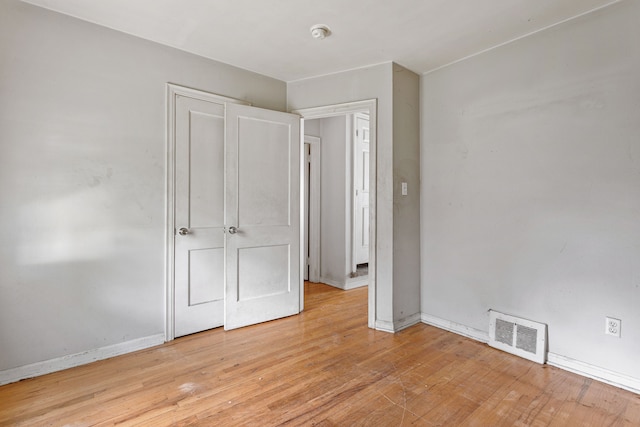 unfurnished bedroom with light wood-type flooring