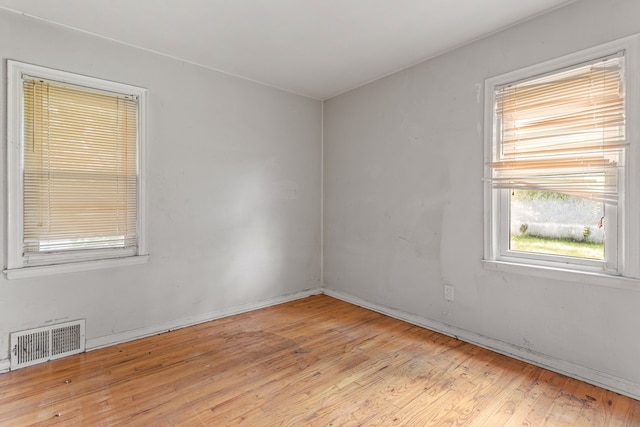 spare room featuring light wood-type flooring