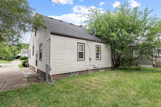 view of property exterior with a yard