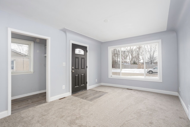 view of carpeted foyer