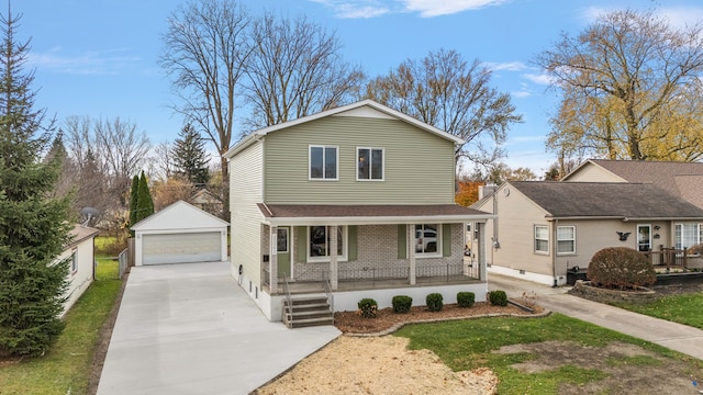 traditional-style home featuring covered porch, an outbuilding, and a garage