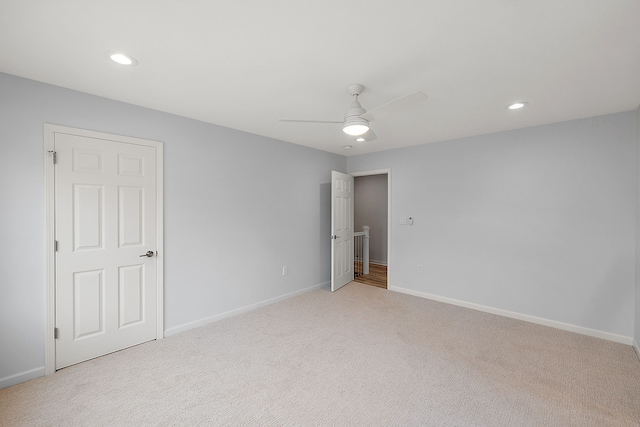 interior space with baseboards, recessed lighting, a ceiling fan, and light colored carpet