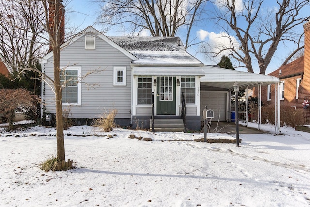 bungalow-style home with a garage and a carport