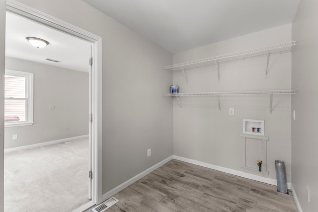 laundry room with hookup for a washing machine and wood-type flooring