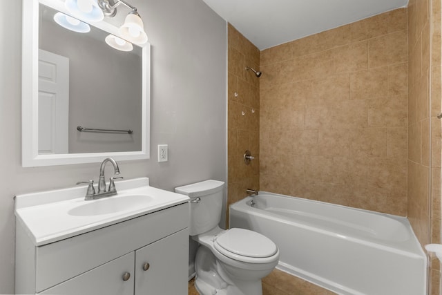 full bathroom featuring vanity, toilet, and tiled shower / bath combo