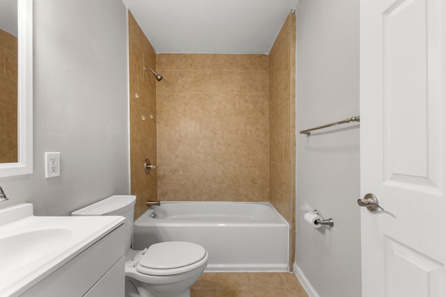 full bathroom with toilet, tiled shower / bath, tile patterned floors, and vanity