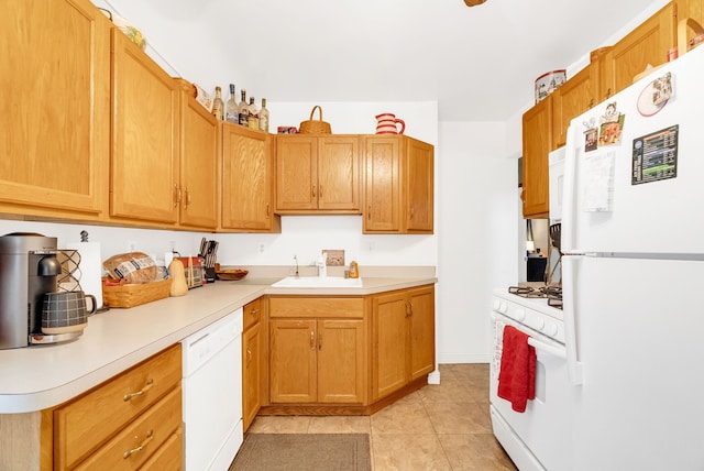 kitchen with sink, white appliances, and light tile patterned floors