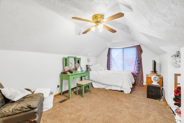 carpeted bedroom with ceiling fan, vaulted ceiling, and a textured ceiling