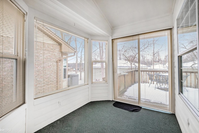 unfurnished sunroom with lofted ceiling