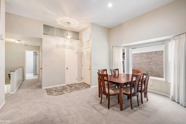 dining room featuring light carpet