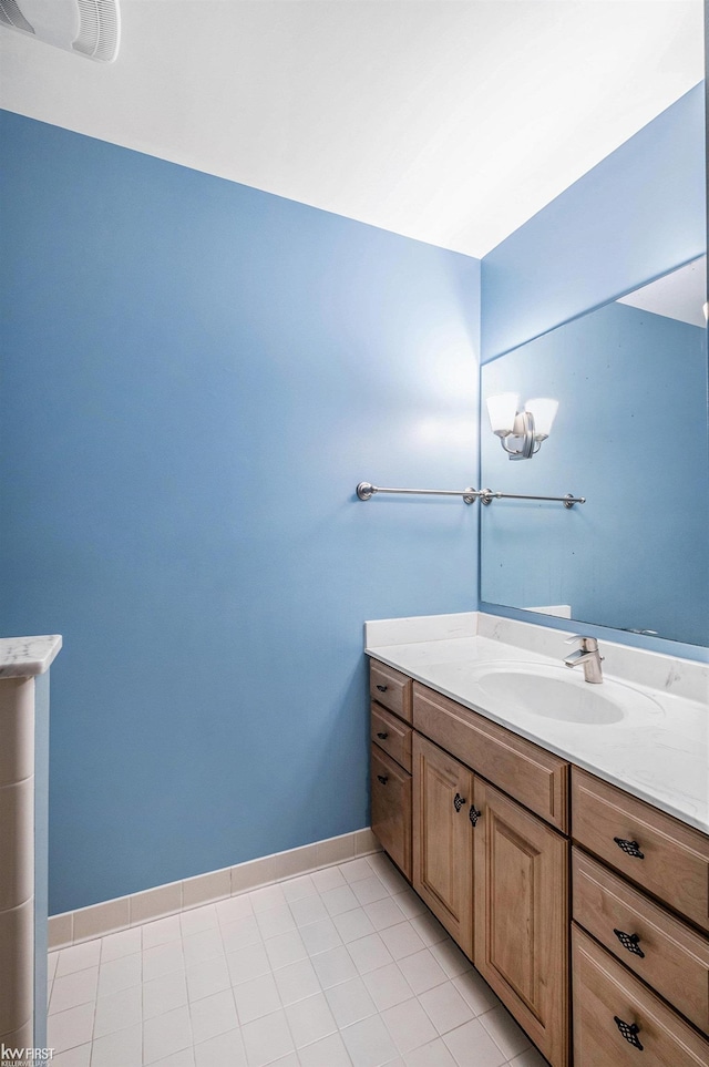 bathroom with vanity and tile patterned floors