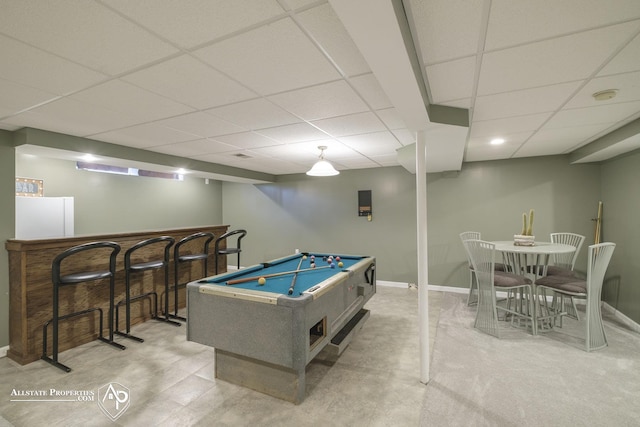 game room with a drop ceiling, billiards, and indoor bar