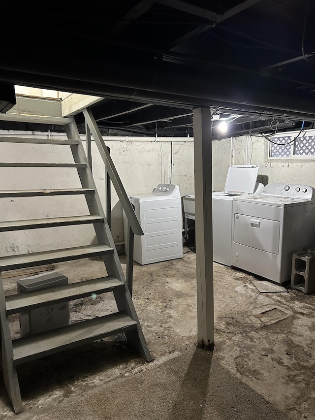 basement with washer and clothes dryer