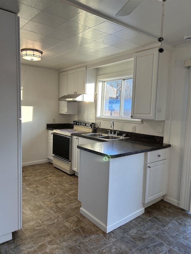 kitchen featuring sink, white cabinetry, and white electric range