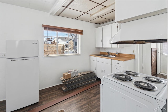 kitchen featuring white cabinets, white appliances, dark hardwood / wood-style flooring, and sink