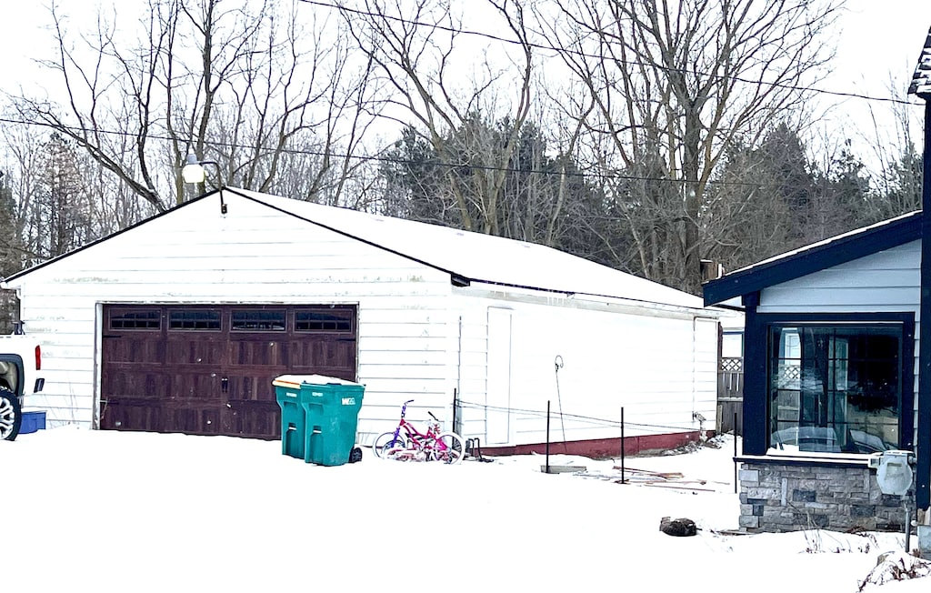 view of snow covered garage