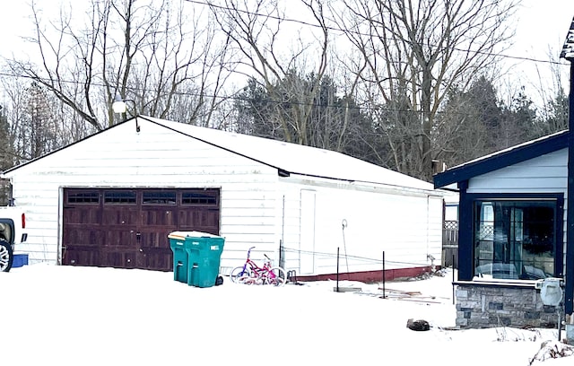 view of snow covered garage