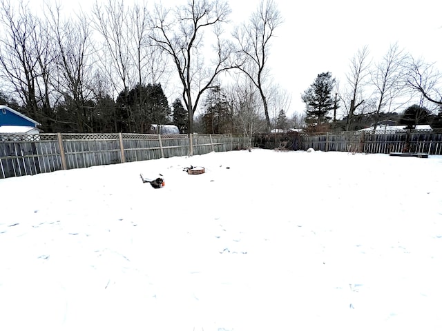 view of yard layered in snow