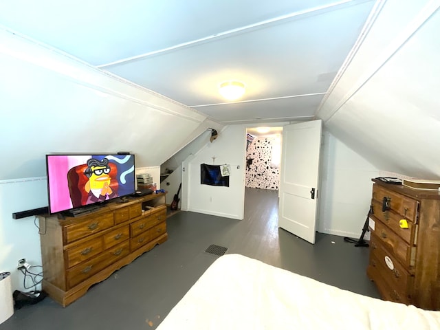 bedroom featuring lofted ceiling