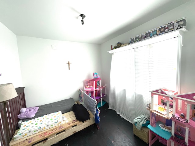 bedroom with dark hardwood / wood-style flooring