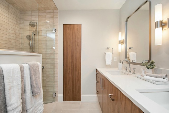 bathroom featuring vanity, tile patterned floors, and an enclosed shower