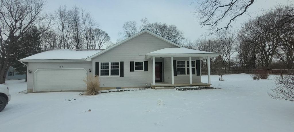 view of front of property featuring a garage and a porch