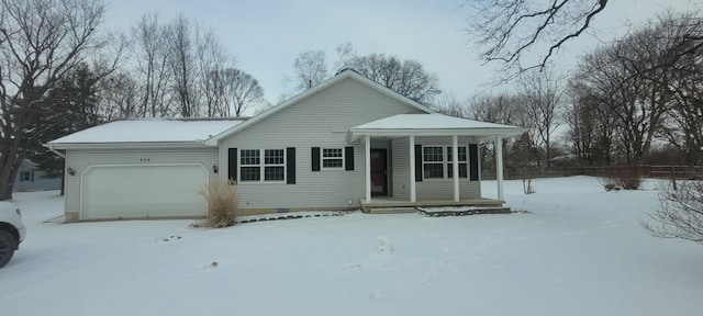 view of front of property featuring a garage and a porch