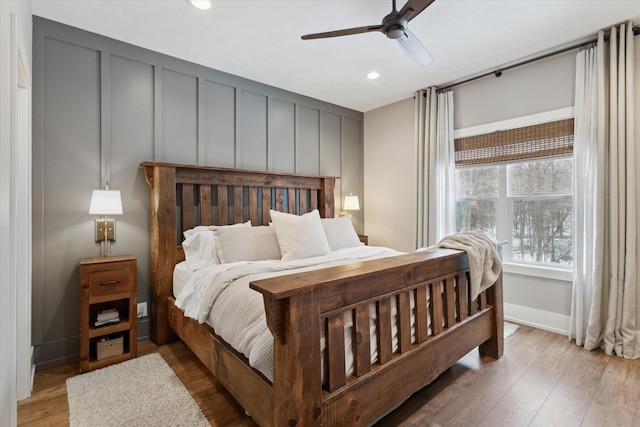 bedroom featuring light wood-type flooring and ceiling fan