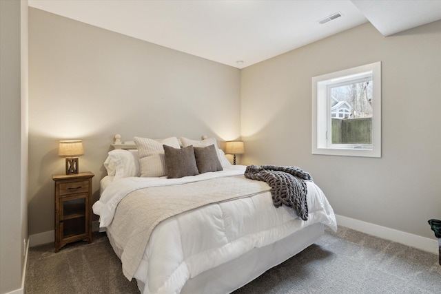 bedroom featuring dark colored carpet