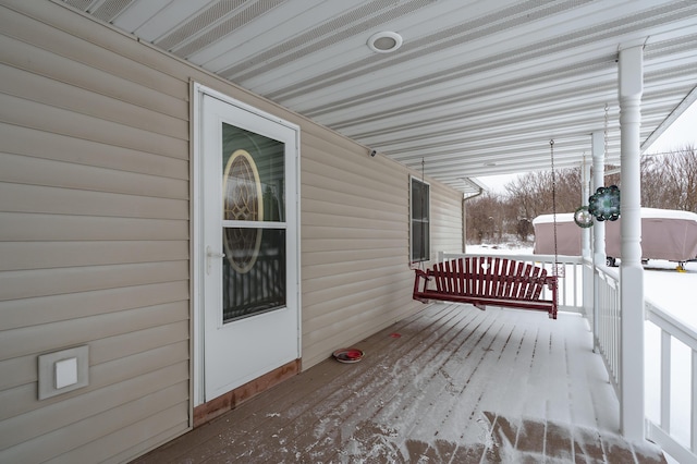 view of snow covered deck