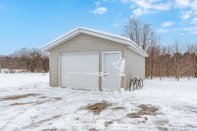 view of snow covered garage