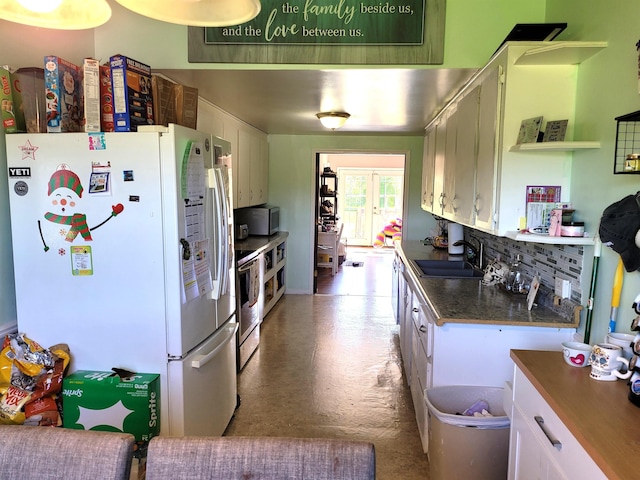 kitchen featuring sink, white cabinets, and appliances with stainless steel finishes