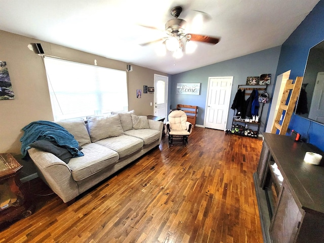 living room featuring ceiling fan, dark wood-type flooring, and vaulted ceiling